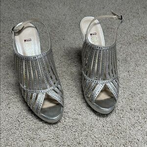 Live from the red carpet, silver, and rhinestone heels
